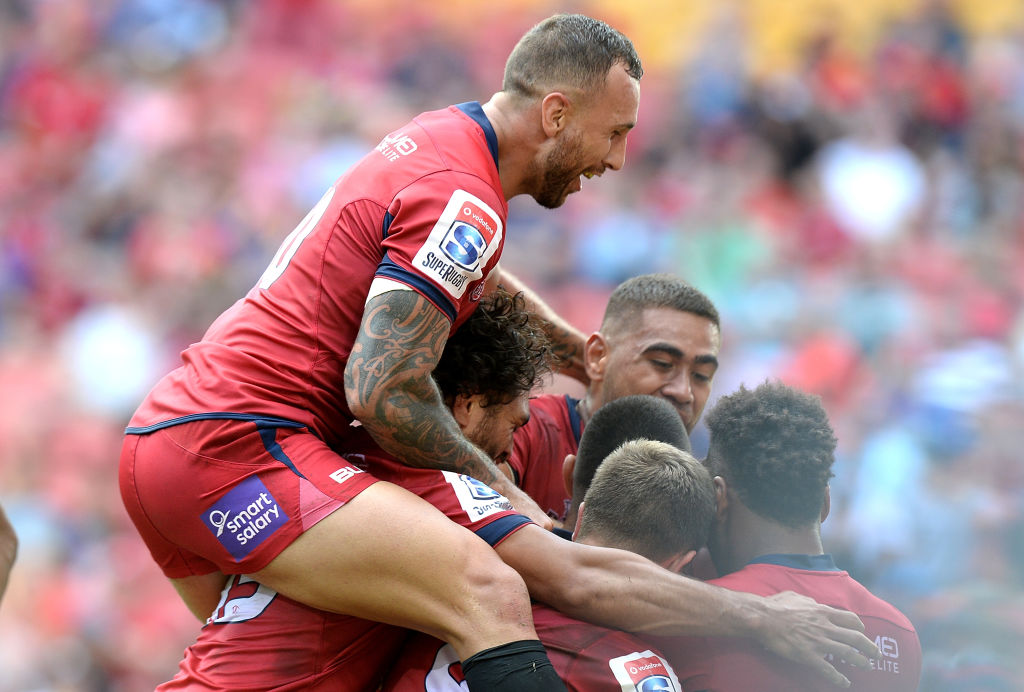 Quade Cooper celebrates with teammates. Photo: Getty Images 