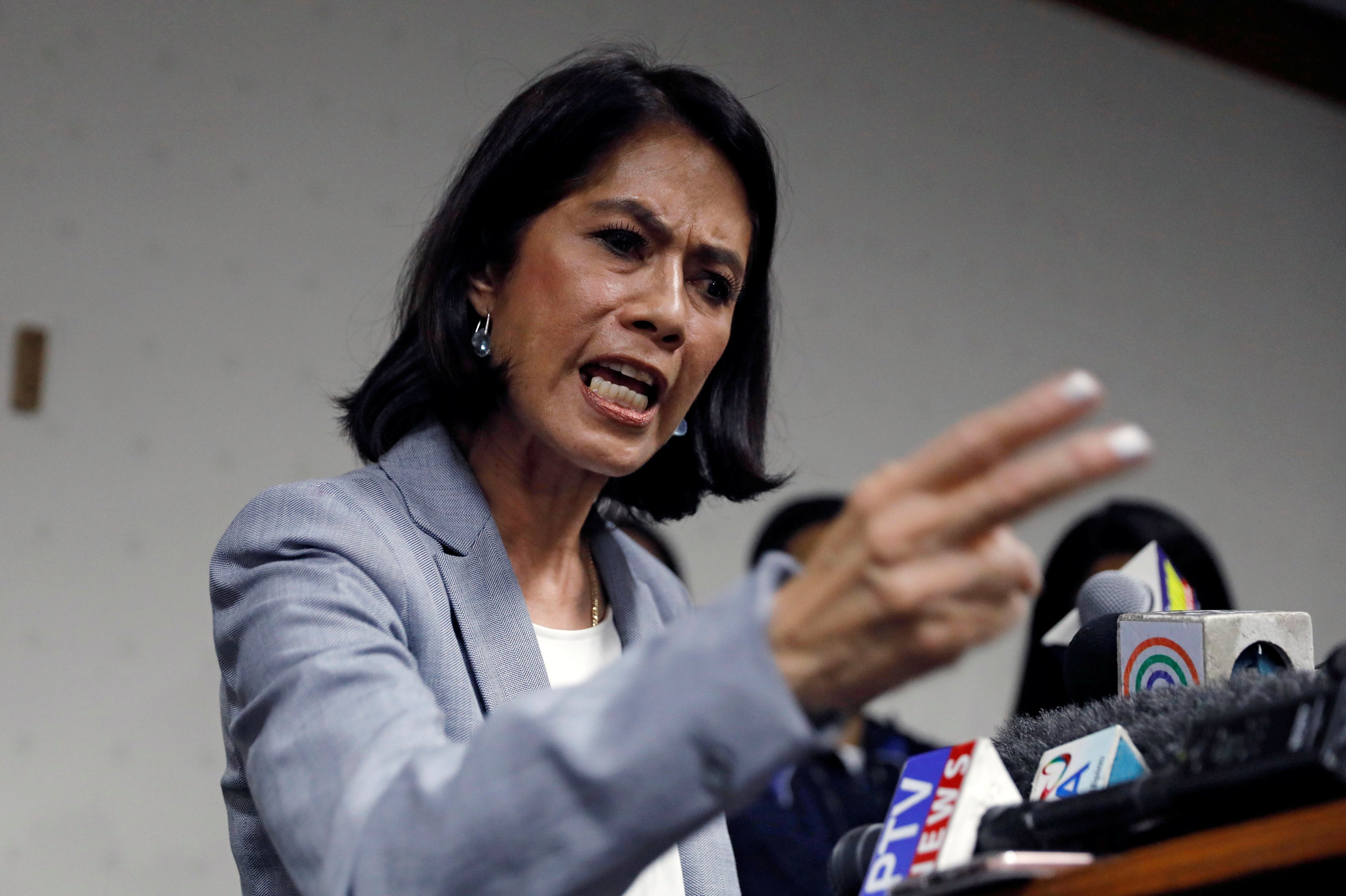 Philippine Environment Secretary Regina Lopez reacts during a news conference after lawmakers on...