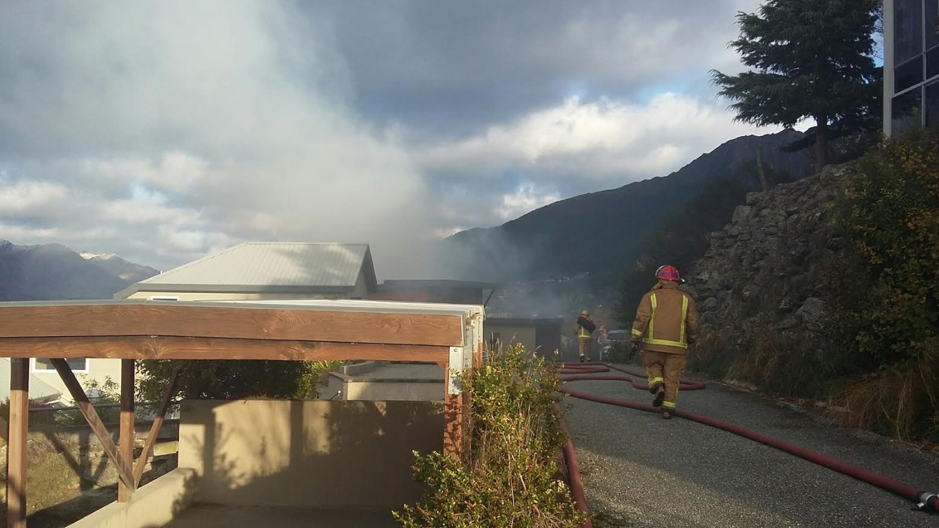 Firefighters at the scene in Queenstown. Photo Louise Scott