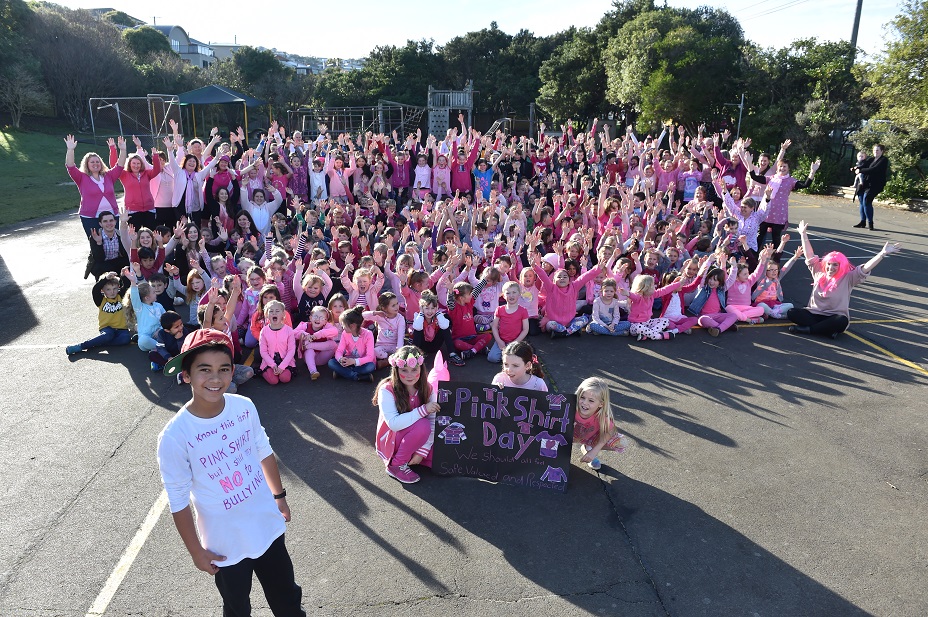Tainui School pupil Corey Te Hei celebrates Pink Shirt Day with the rest of the school yesterday,...