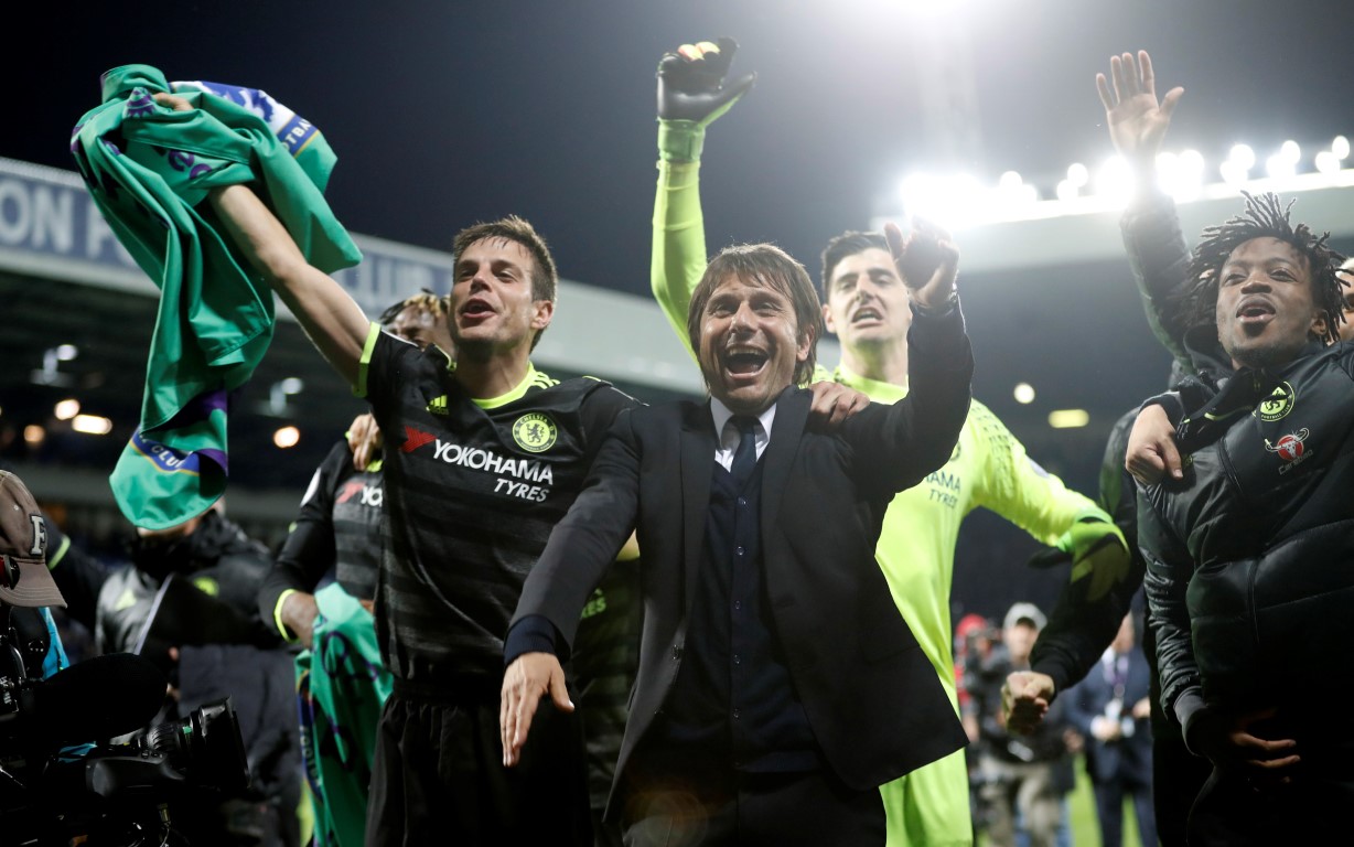 Chelsea manager Antonio Conte celebrates with his players after they secured the Premier League...