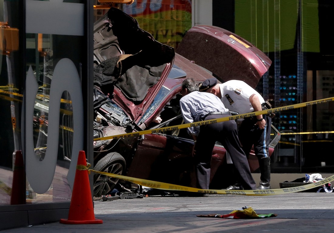 Police inspect the vehicle after the incident. Photo Reuters
