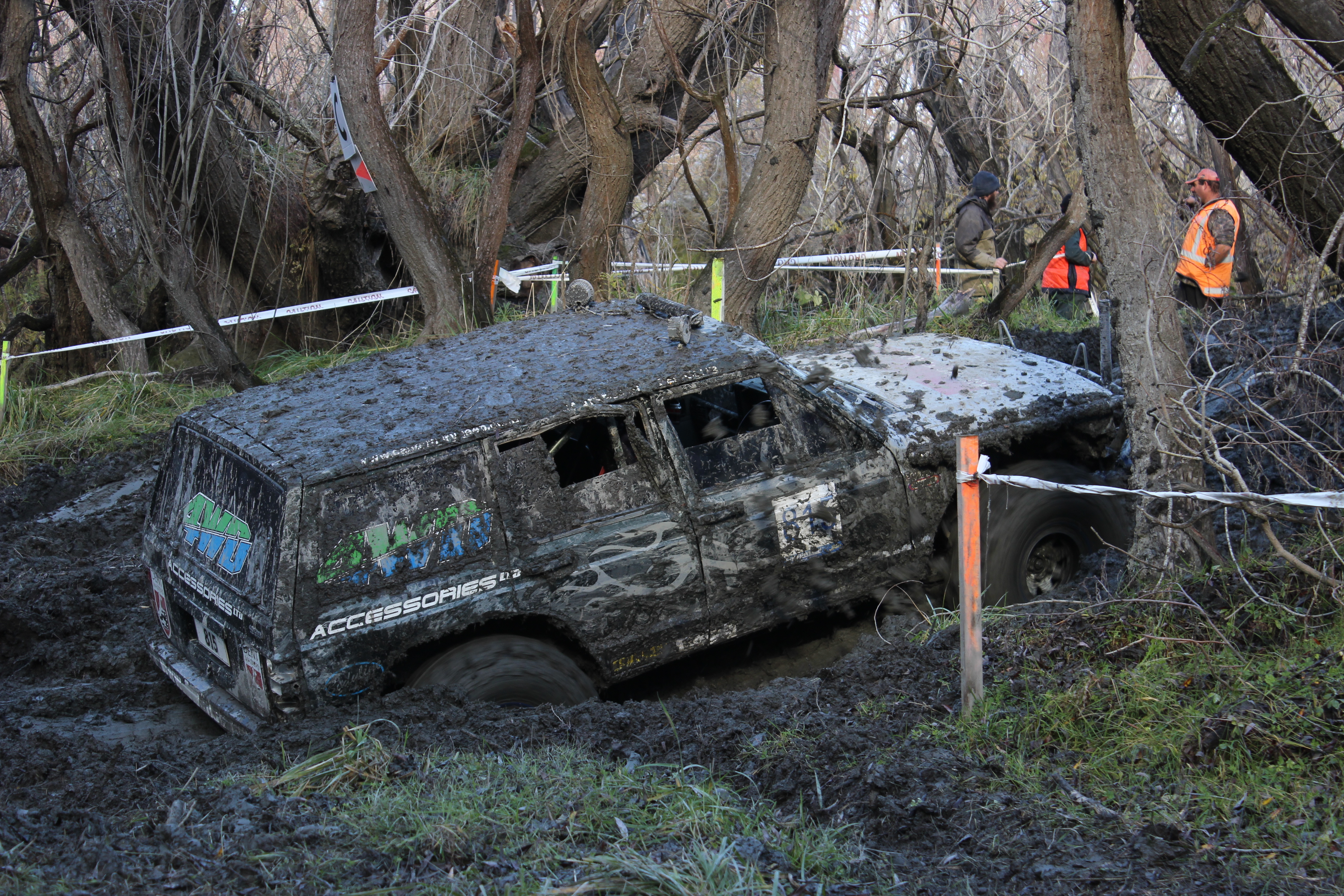 A 4WD driver tries to break his vehicle free from a sticky situation at the South Island Winch Championships in Alexandra. Photo: Jono Edwards.