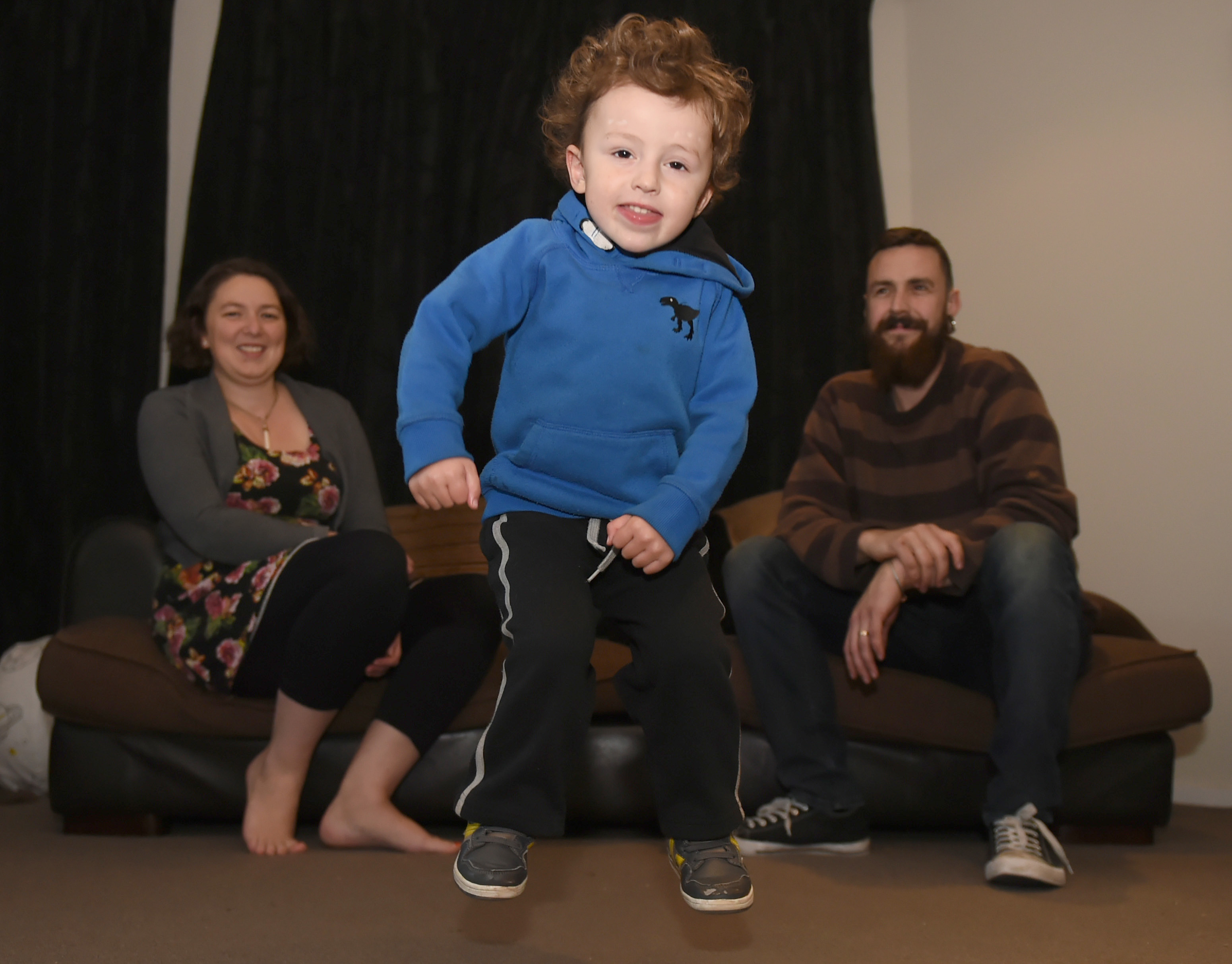 Angus Budd shows off his jumping skills in front of his parents, Amy-Lee and Richard, at their...