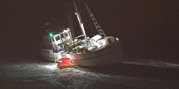 A fishing boat was stranded on a sandbar near Cobden Beach. Photo: file