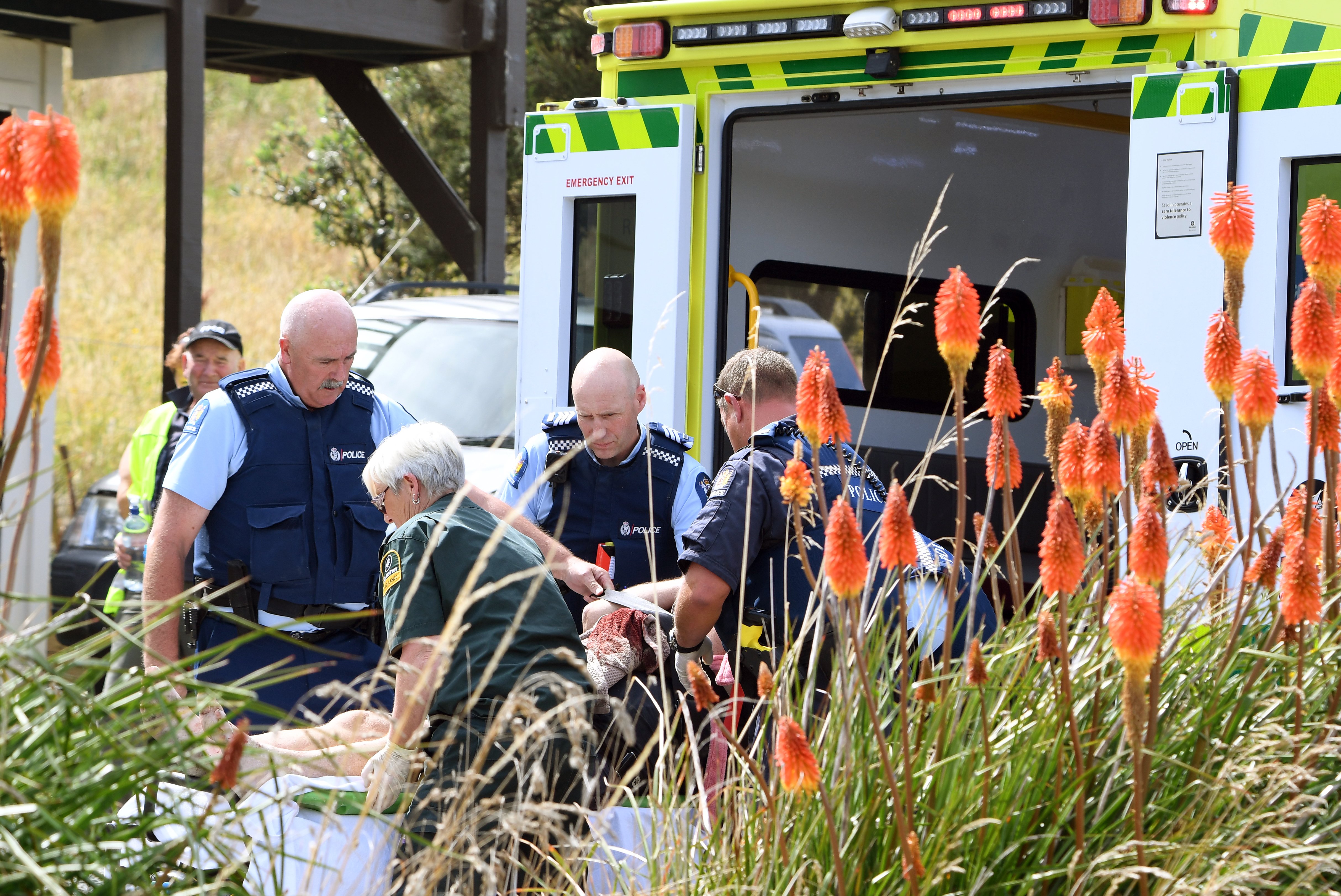 The victim of Shaan Roker’s machete attack in Taieri Mouth is carried to an ambulance on February...