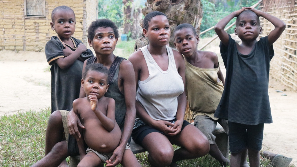 Pygmies women and children, the girl in white is pregnant and abandoned by her boyfriend. Photo:...
