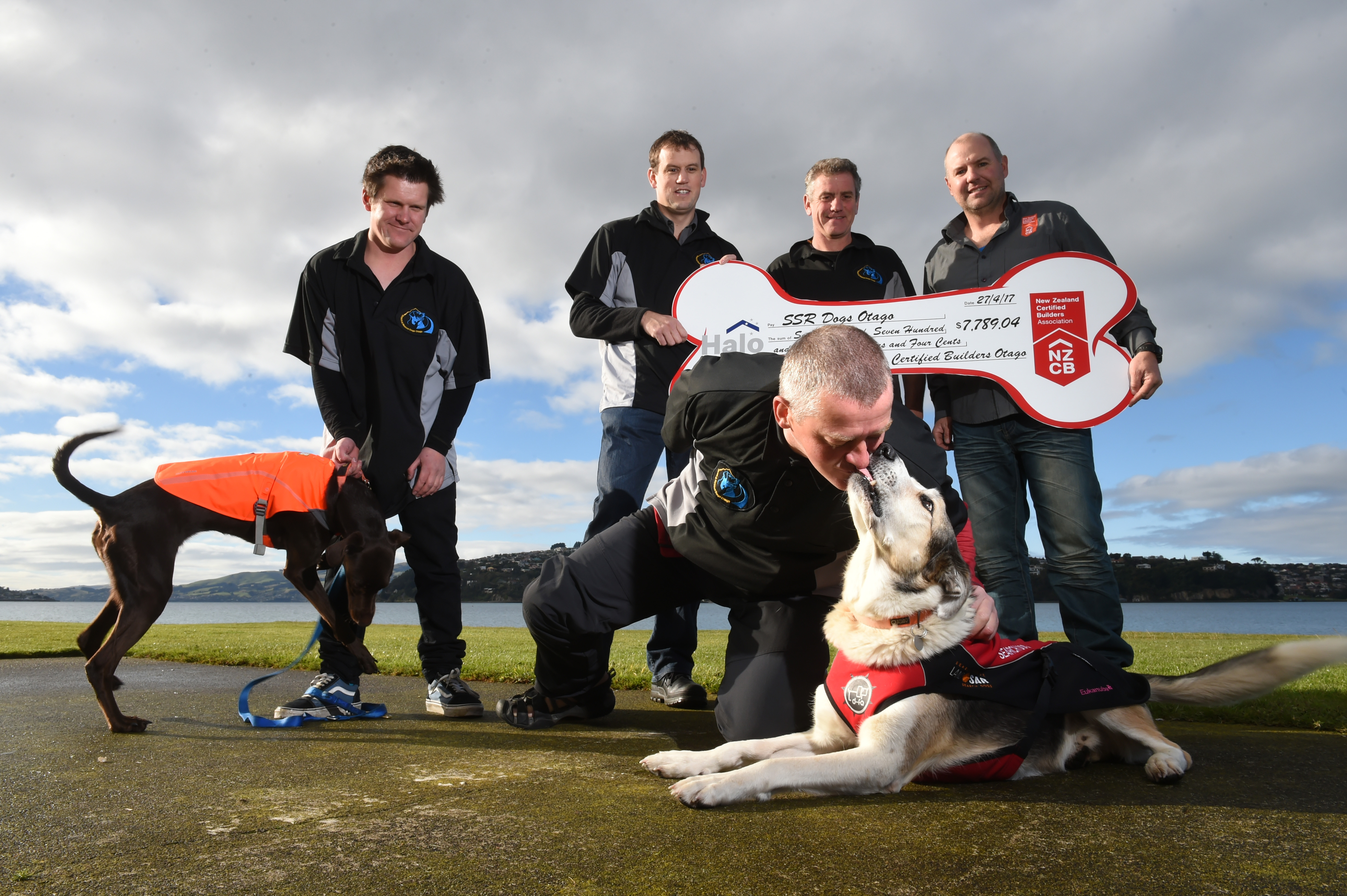 Dermot Mayock gets some love from search and rescue dog Fin as New Zealand Certified Builders...