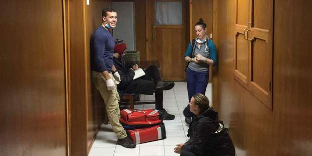 The team debriefed afterwards. Photo: supplied/NZ Herald