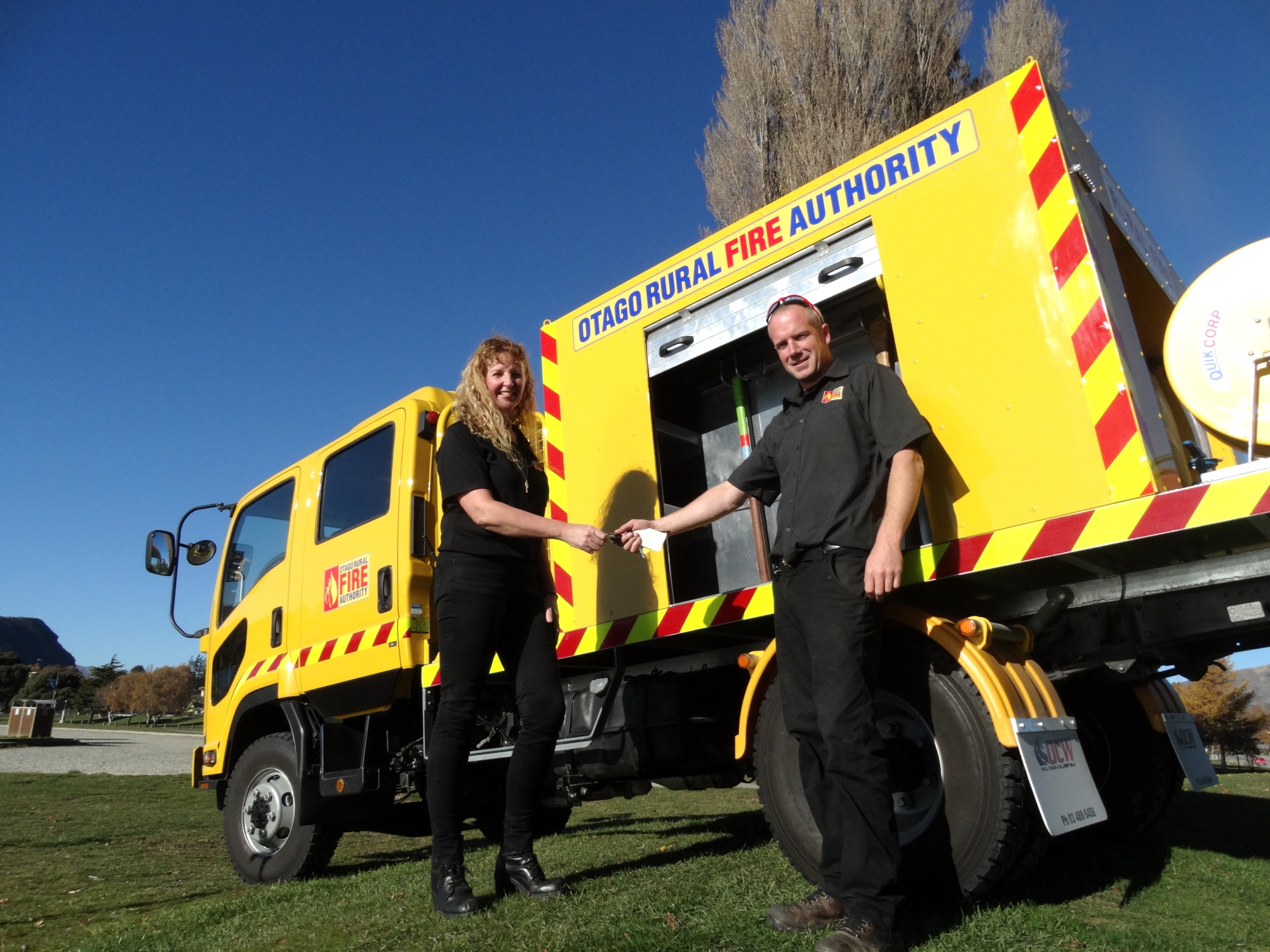 Otago Rural Fire Authority deputy principal fire office Pete Scarlet hands the keys for the...