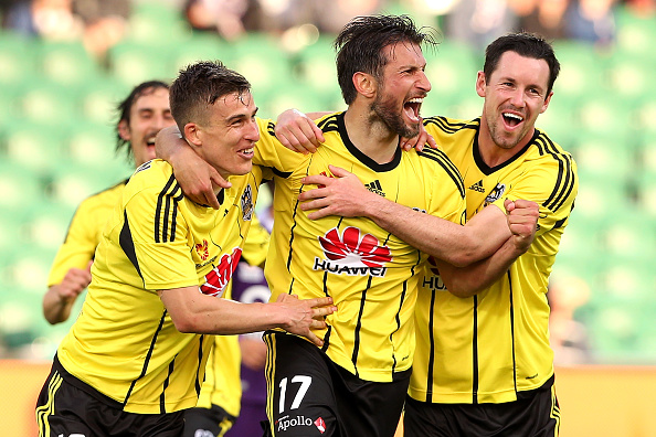 Wellington Phoenix players celebrate a goal.