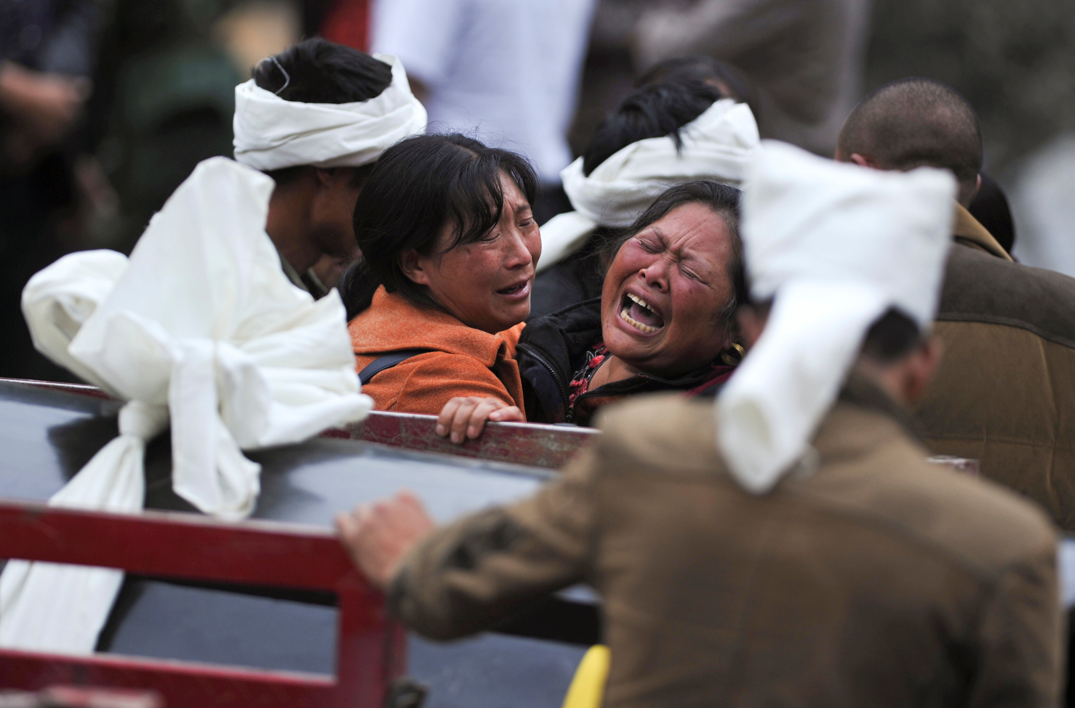 Family members want answers about the landslide in China. Photo: Reuters