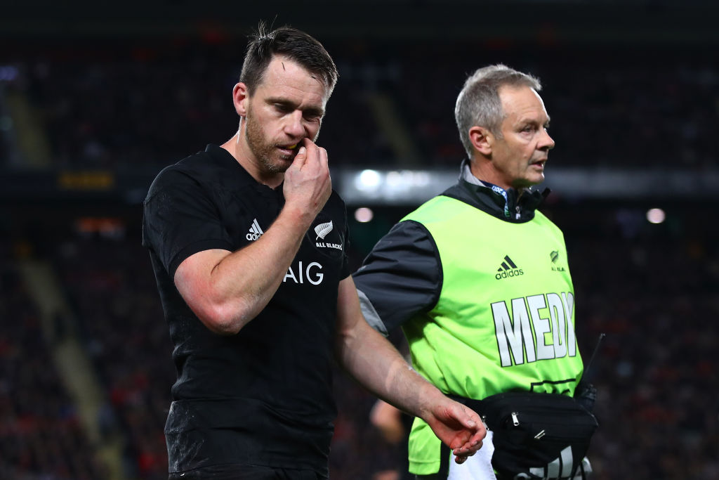 Ben Smith leaves the field after taking a head knock during the first test between the All Blacks...