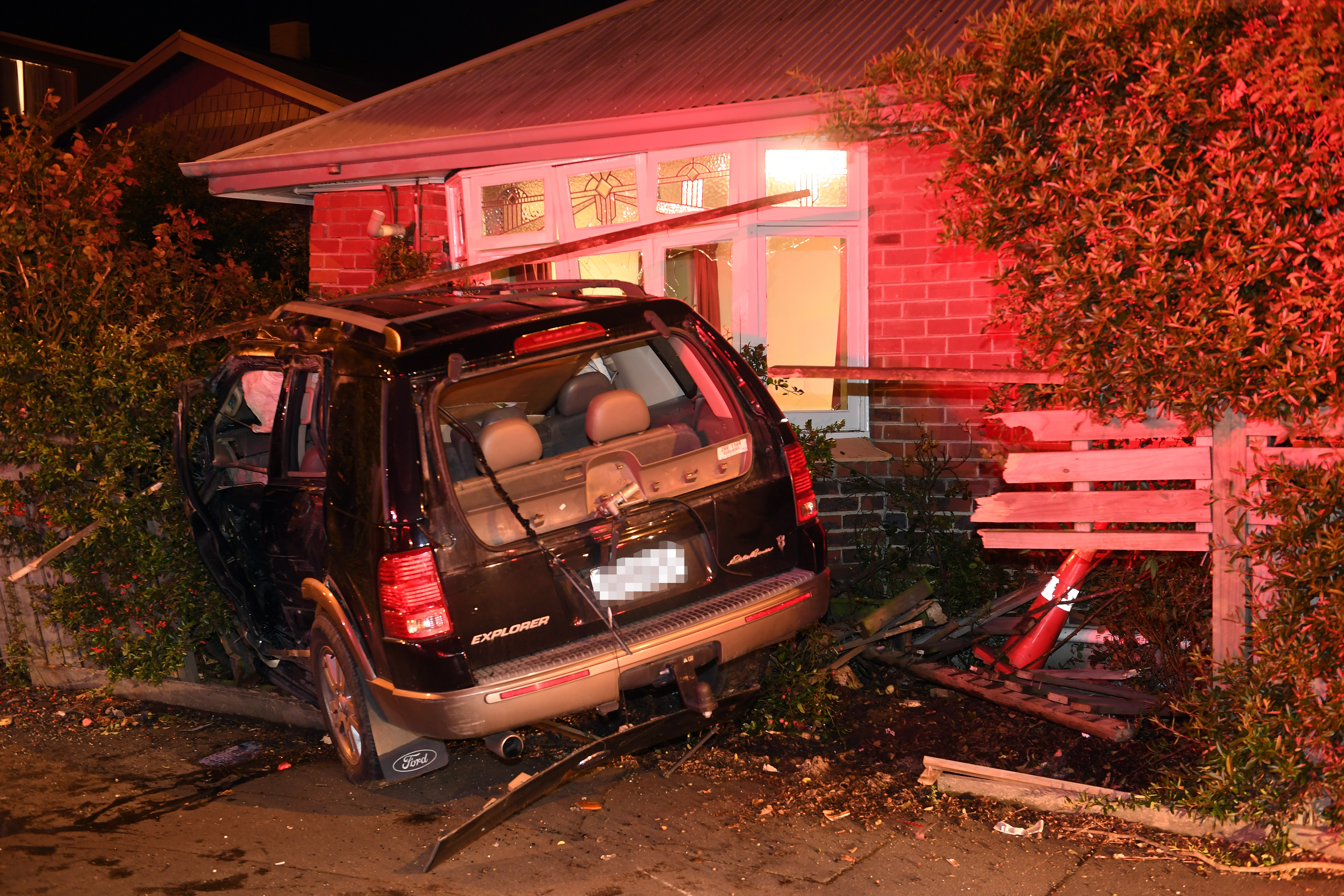 A Ford Explorer has crashed into a house on Great King St in Dunedin. Photo: Stephen Jaquiery