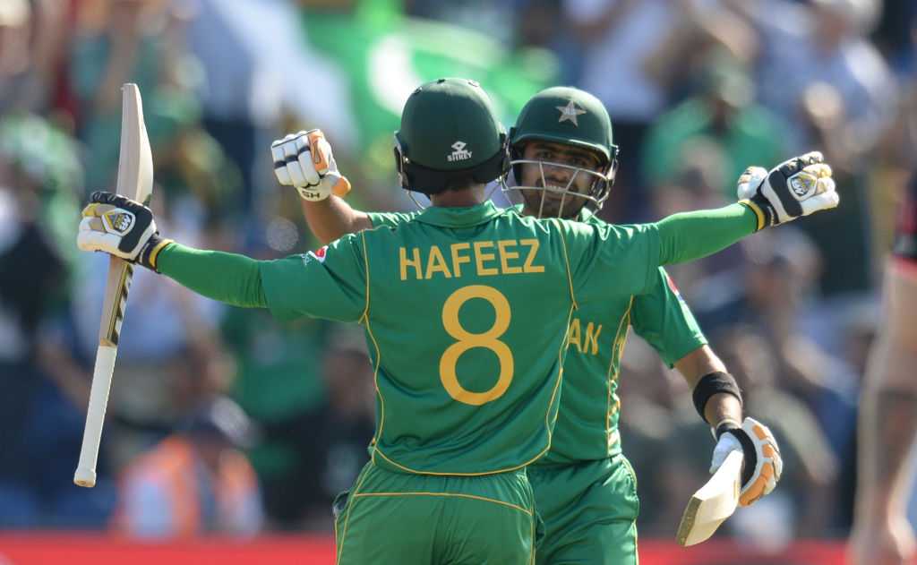 Babar Azam and Mohammad Hafeez of Pakistan embrace after beating England. Photo: Getty