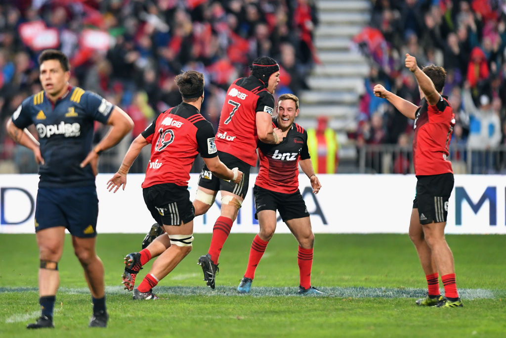 The Crusaders celebrate the kick that won the game. Photo: Getty