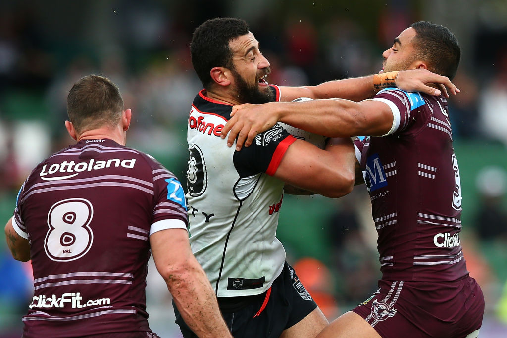 Ben Matulino of the Warriors gets tackled by Dylan Walker of the Sea Eagles. Photo: Getty