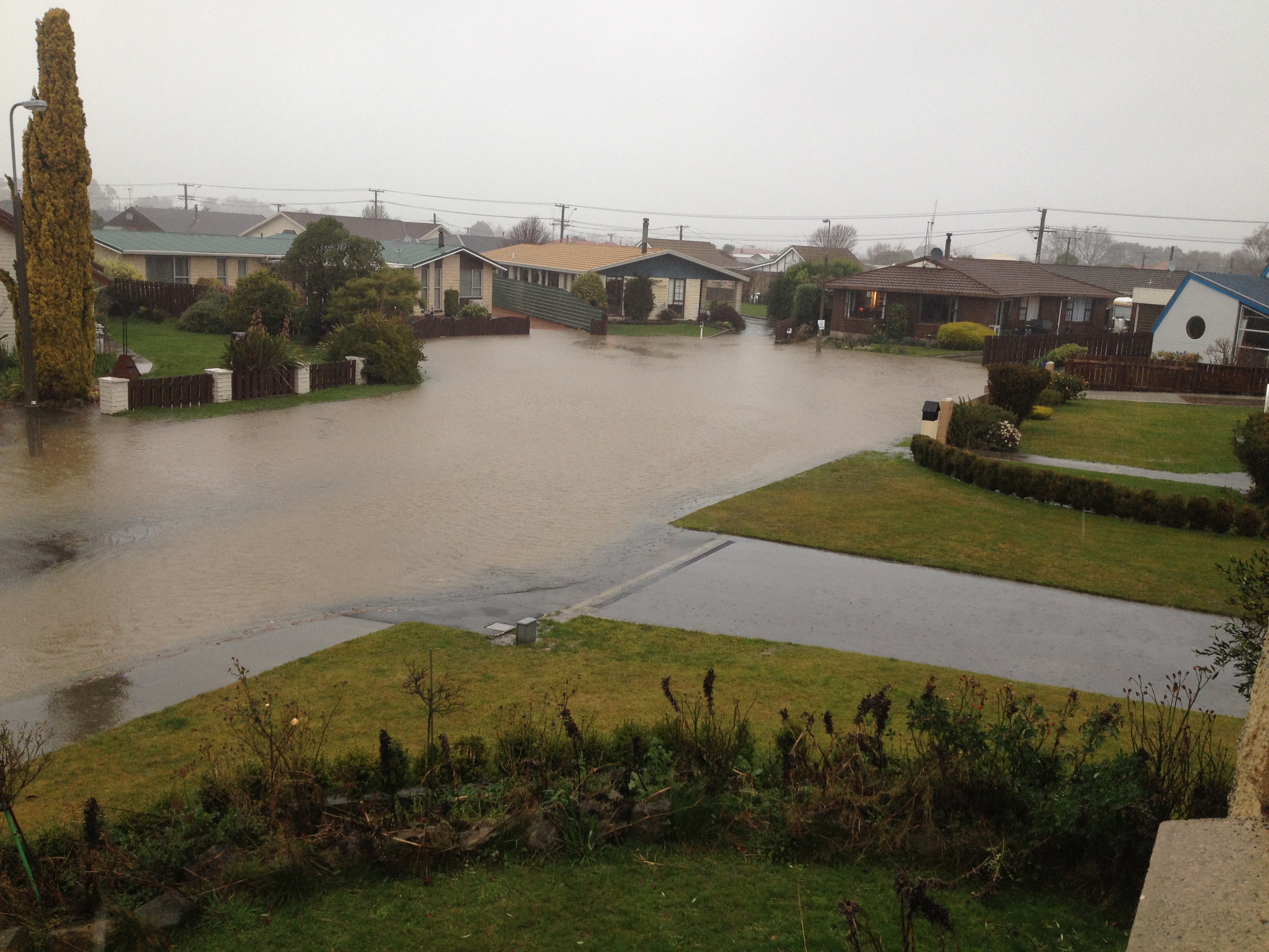 Otter Street in Oamaru has flooded. Photo: Hayden Meikle