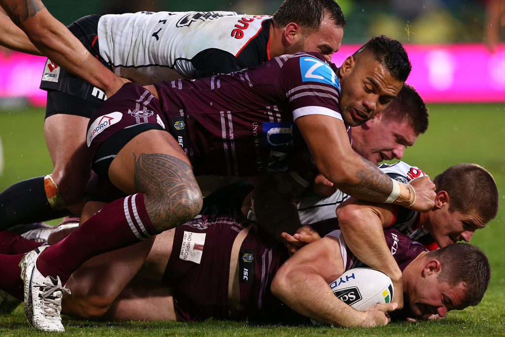 Brenton Lawrence of the Sea Eagles gets tackled. Photo: Getty