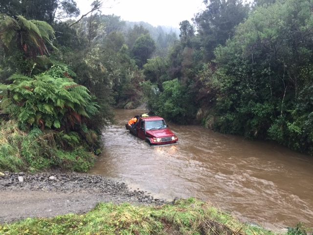 Rescuers battled rising floodwaters to reach the man. Photo: NZ Police