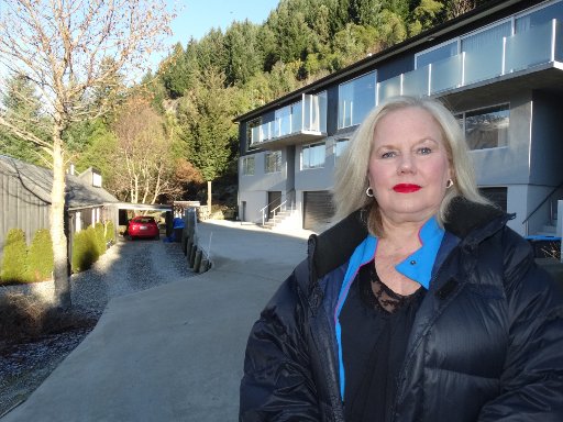  Heidi Ross in front of the holiday home, with her property to the left. Photos: Paul Taylor