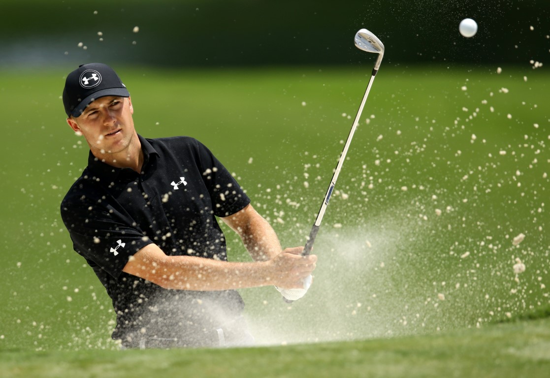 Jordan Spieth plays from a bunker on the 15th hole during a practice round for the 2017 PGA...