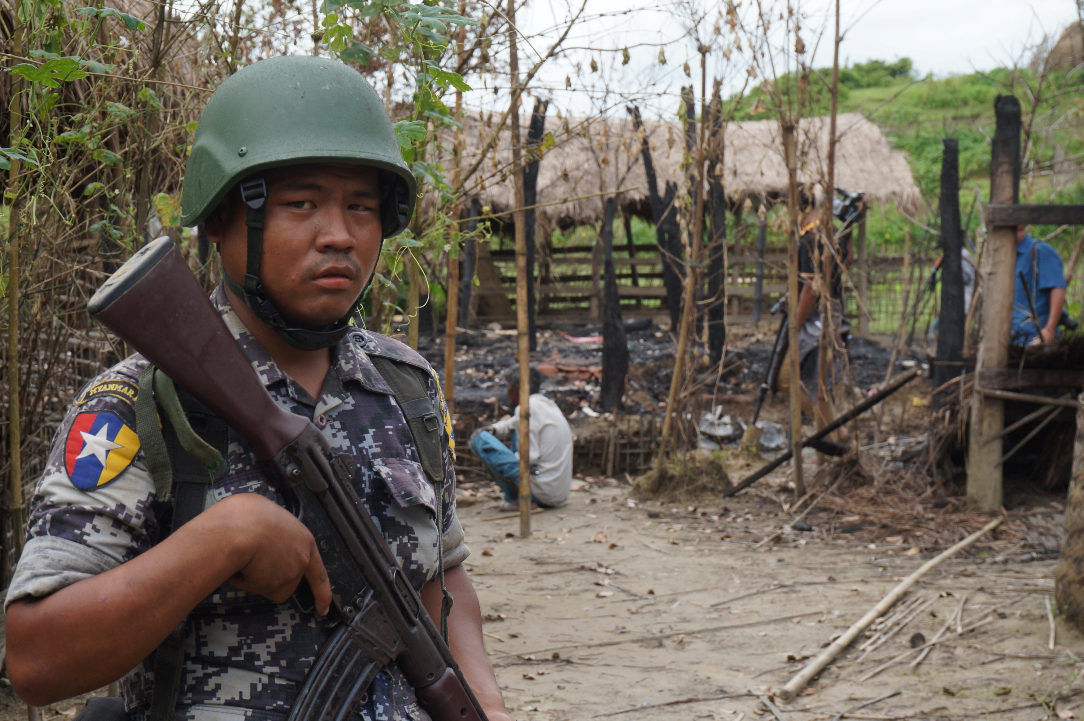 A Myanmar border guard police officer stands guard. Photo: Reuters