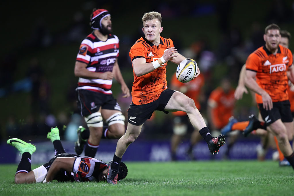 Damian McKenzie makes a break for the All Blacks against Counties during the Game of Three Halves...