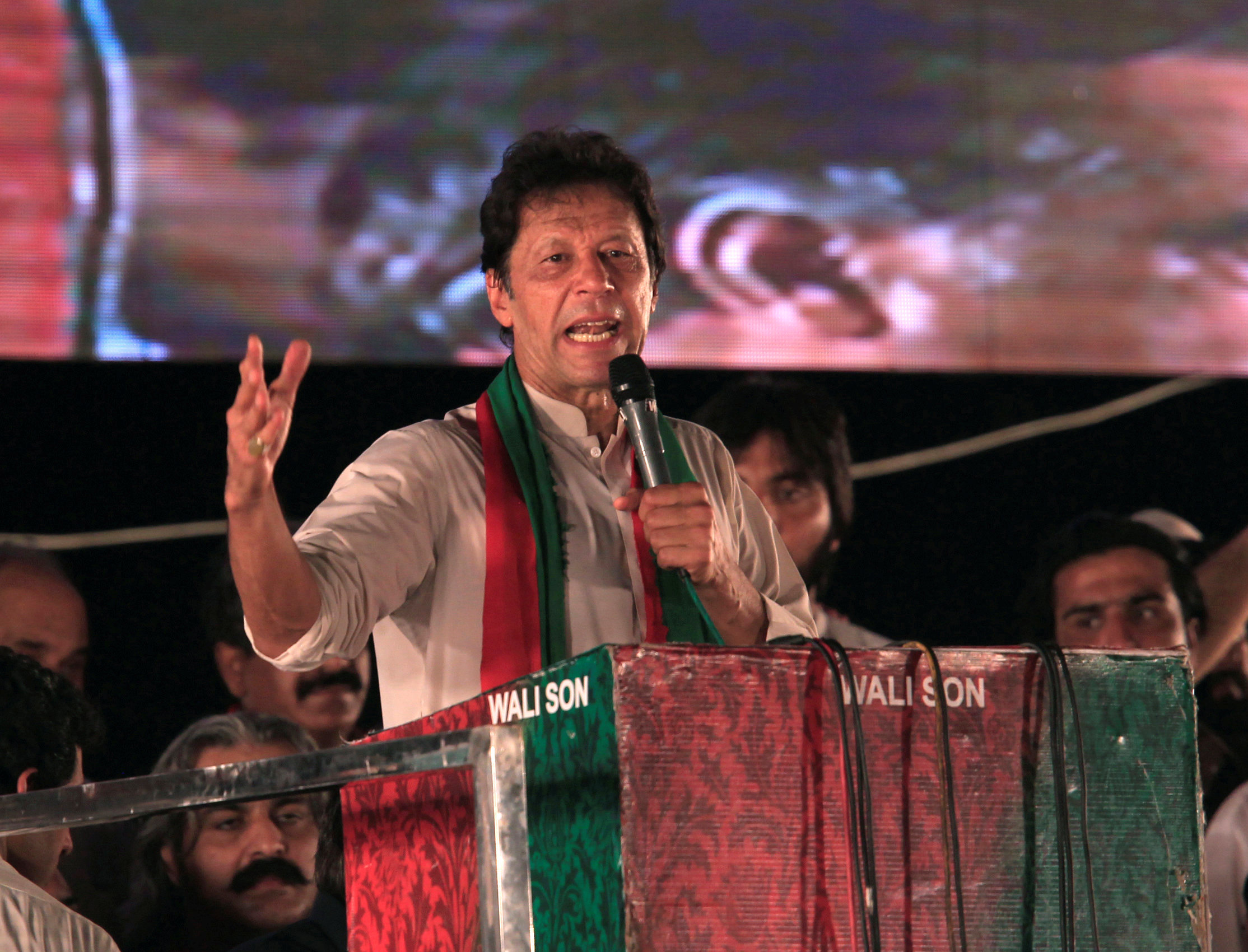 Opposition leader Imran Khan speaks to supporters during a celebration rally after the Supreme...