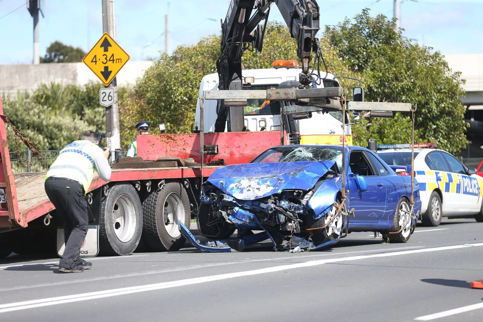 The vehicle is removed from the scene following the crash. Photo: NZ Herald