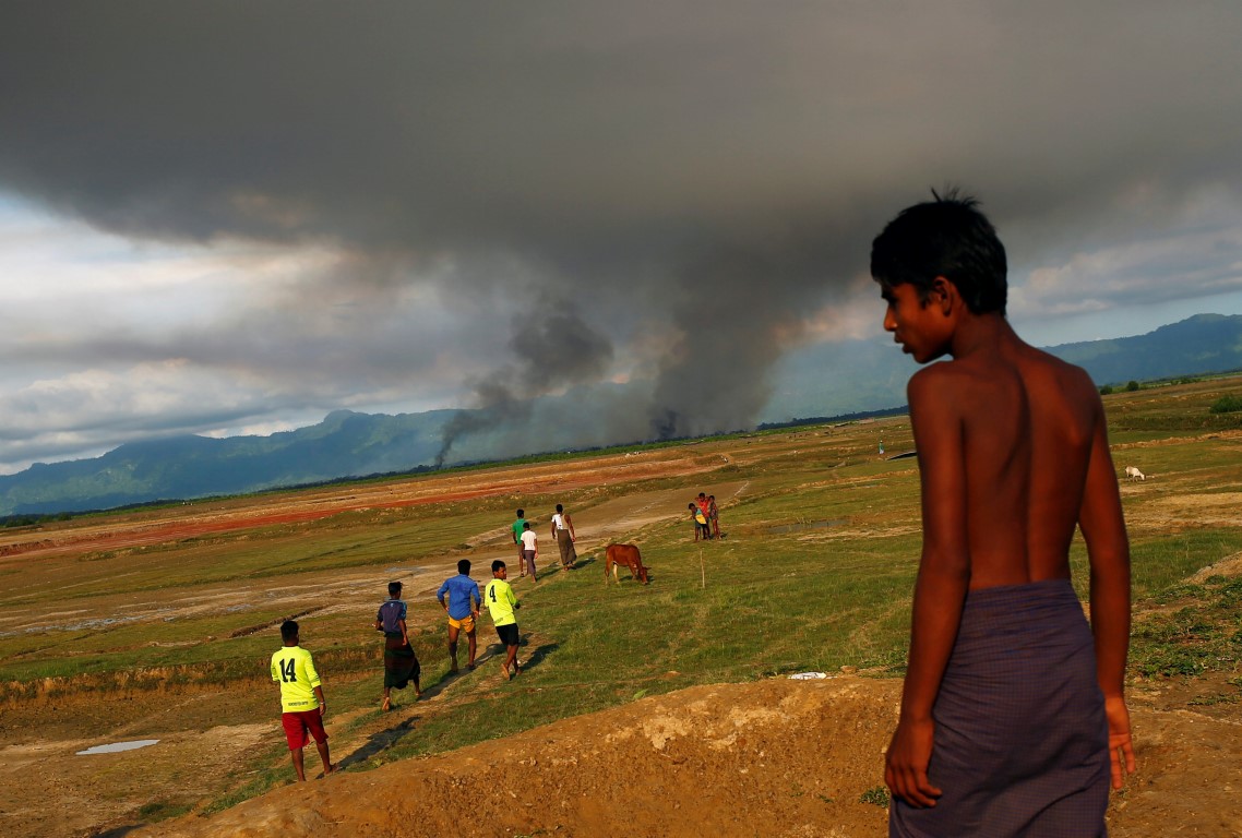 A large plume of smoke is seen on the Myanmar side of the border from Teknaf, Bangladesh. Photo:...