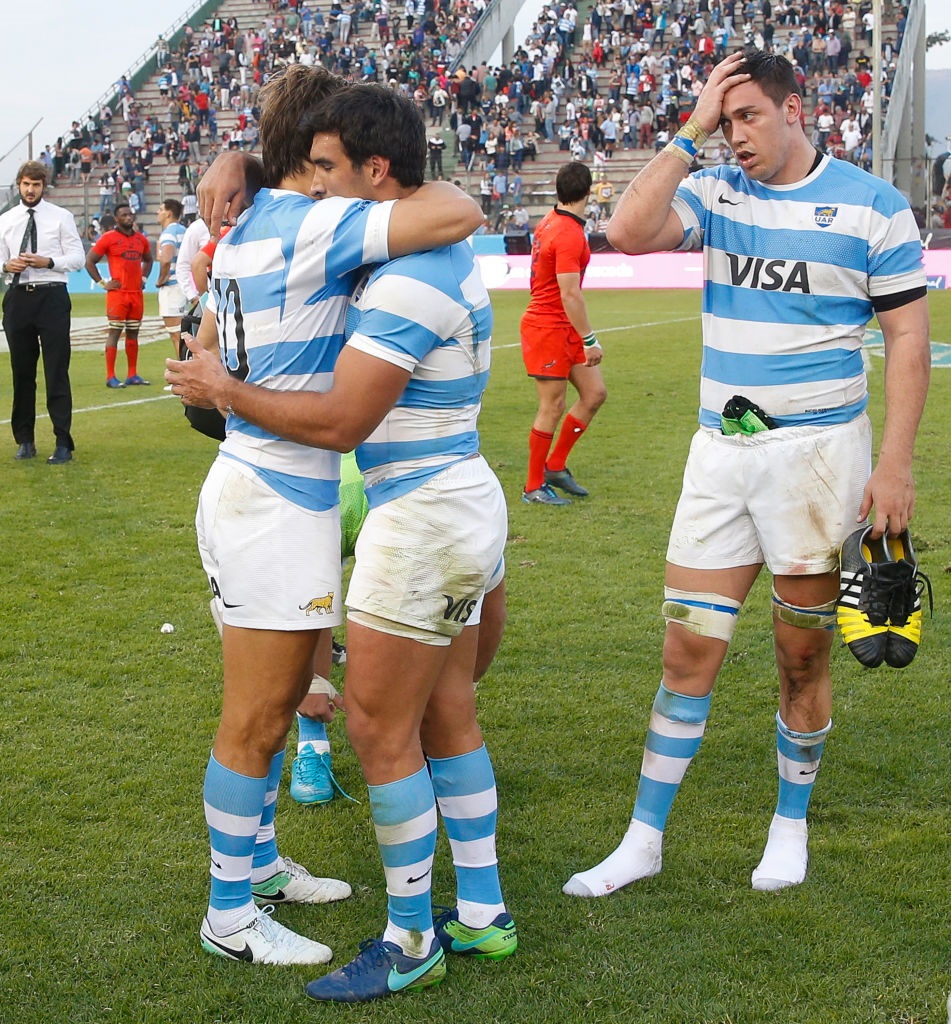 Argentina players Juan Martin Hernandez and Matias Orlando react after their loss to the...