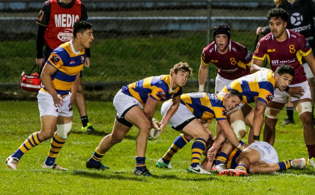 Bay of Plenty halfback Richard Judd clears the ball from a ruck during the team's win over...