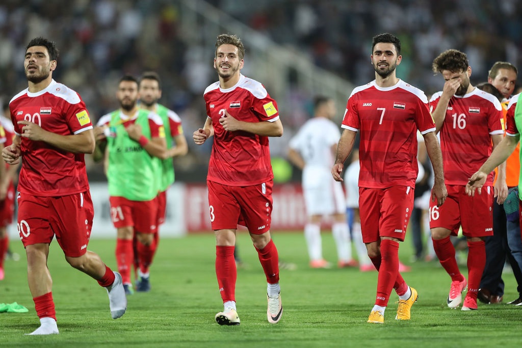 Syria players celebrate after their FIFA 2018 World Cup Qualifier win against Iran in Tehran....