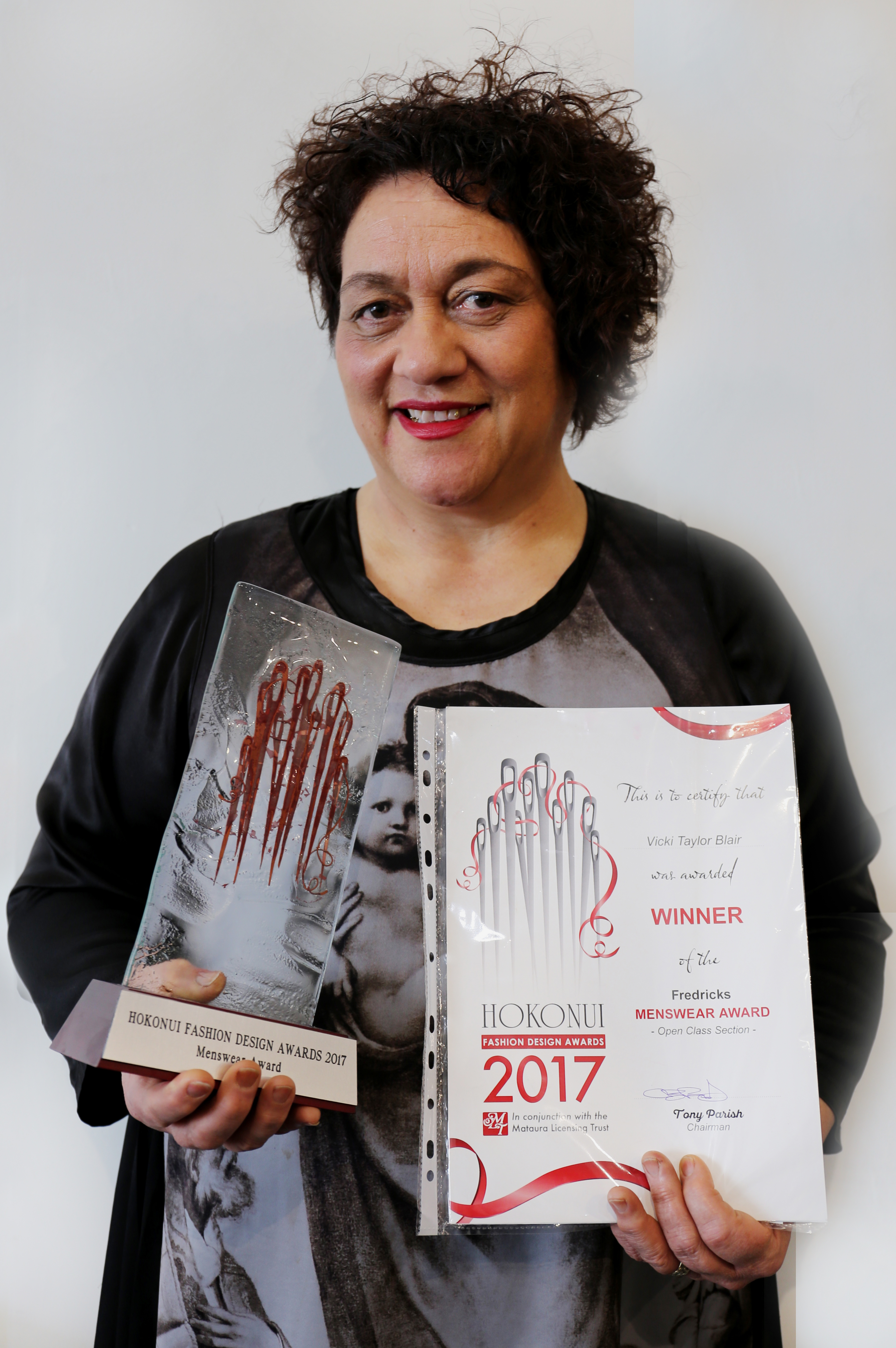 Vicki Taylor-Blair with the trophy and certificate she won at the 2017 Hokonui Fashion Design...