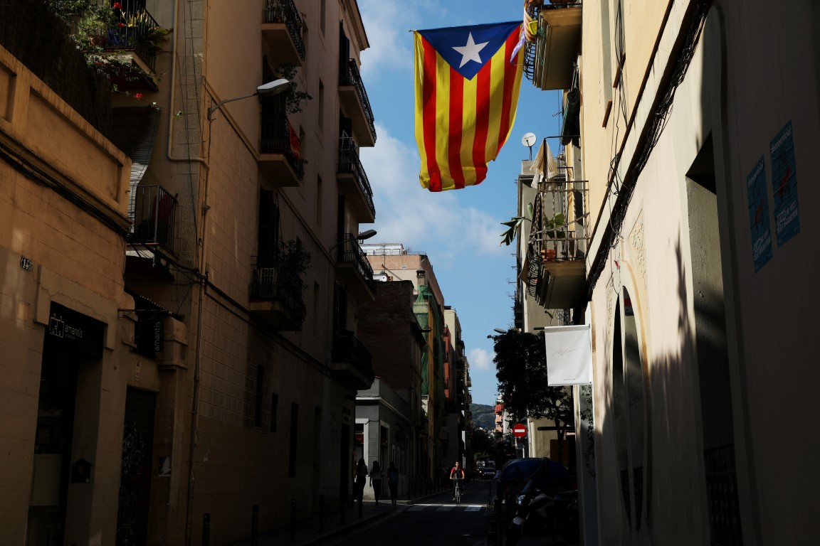 A Catalan separatist flag hangs from a balcony in Barcelona. Photo Getty
