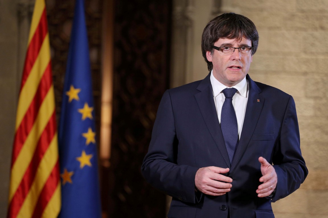 Catalan President Carles Puigdemont gives a speech at the Palau de la Generalitat, the regional...