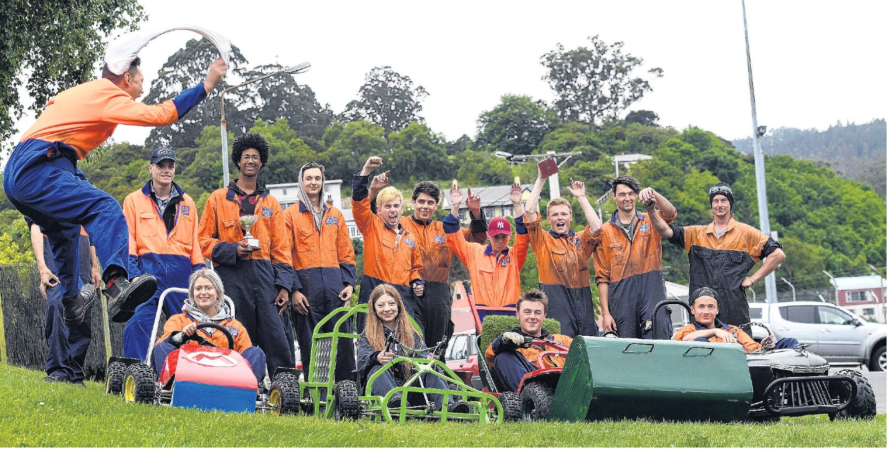 Otago Polytechnic student Mason Lee (17) gives the go signal for grass kart drivers (from left)...