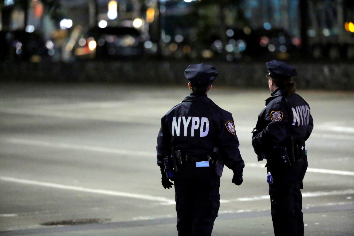 Police look towards the scene after the attack took place on West Side Highway in Manhattan....