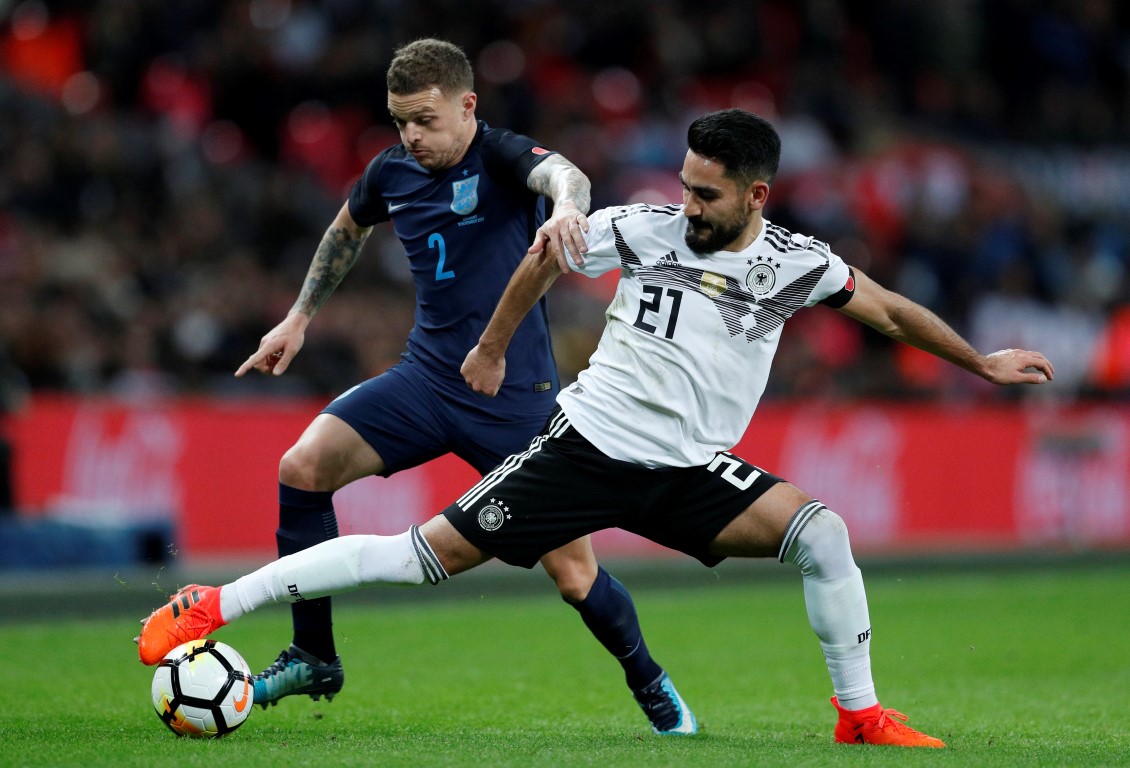 Germany’s Ilkay Gundogan (R) in action with England’s Kieran Trippier. Photo: Reuters