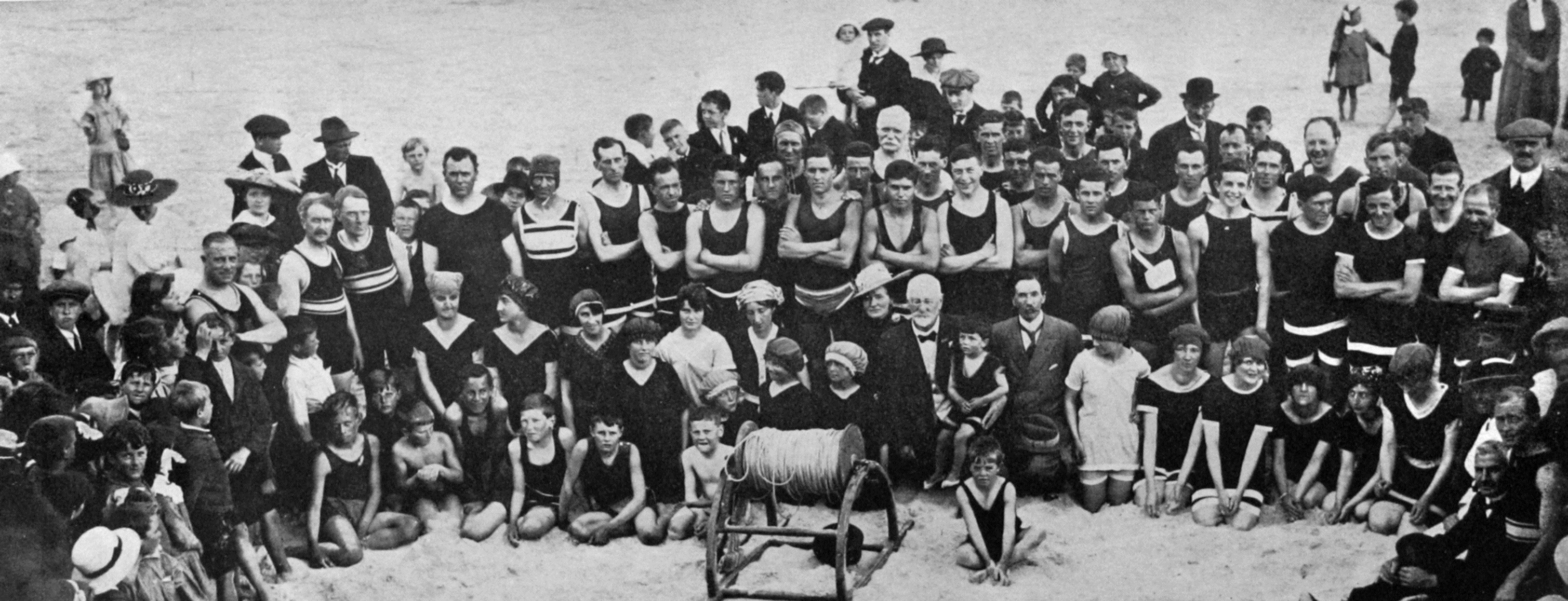 A group of bathers at the opening of the season by the St Clair Surfing and Life-saving Club. - Otago Witness, 19.12.1917. 