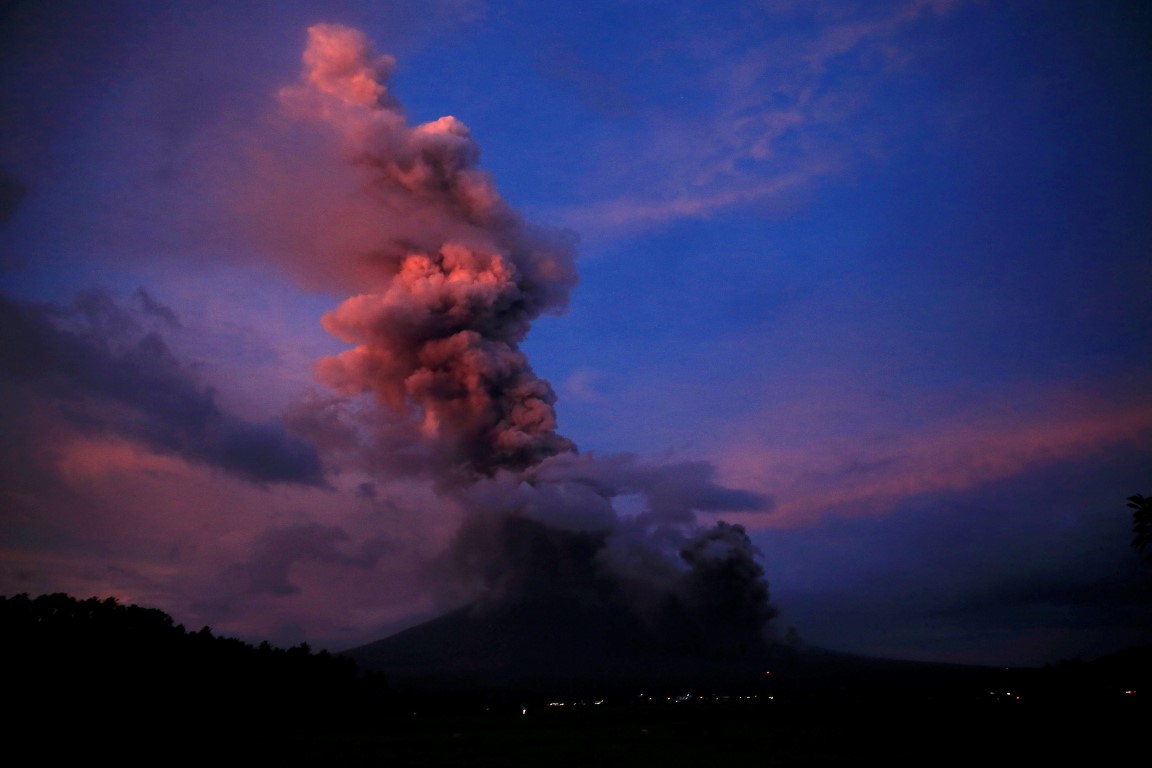Tens of thousands flee as Philippines volcano spews ash three miles high