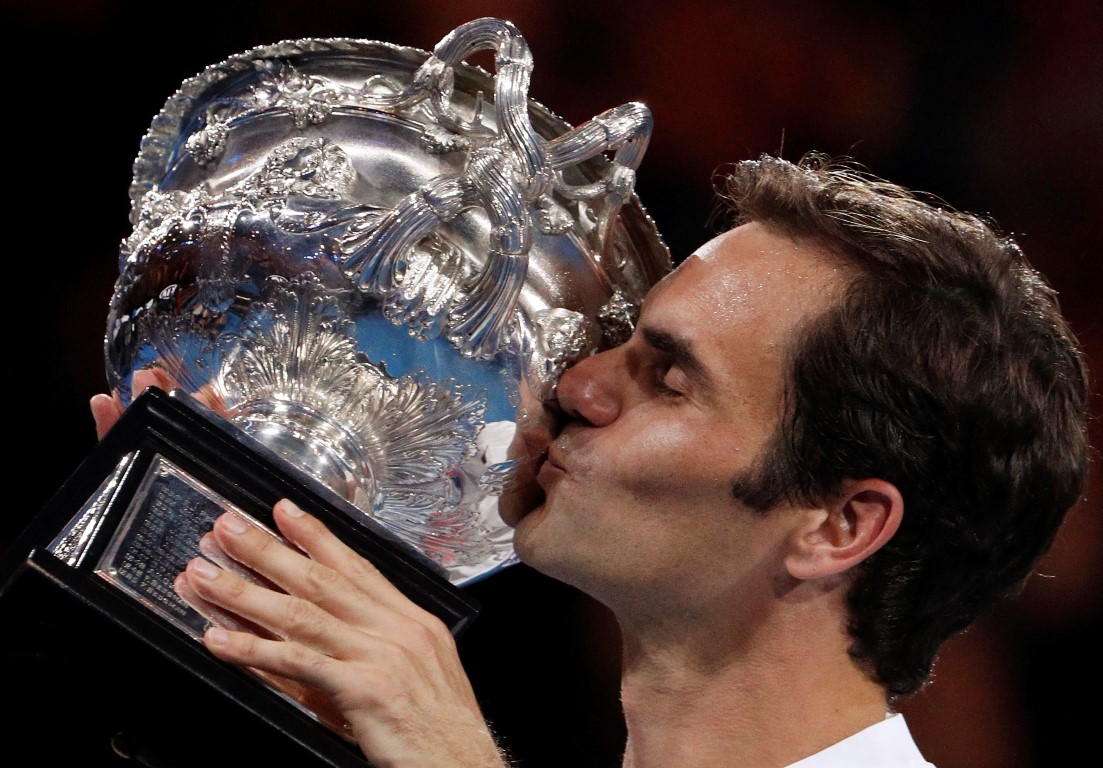 Roger Federer celebrates with the trophy after his victory in the Australian Open. Photo Reuters