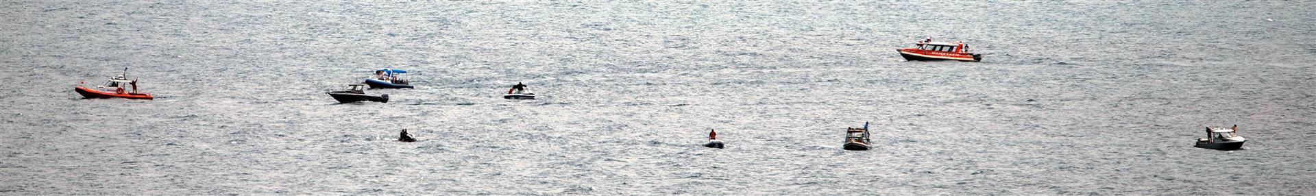 Searchers scour Lake Wakatipu for the missing skydiver. Photo: James Allan Photography