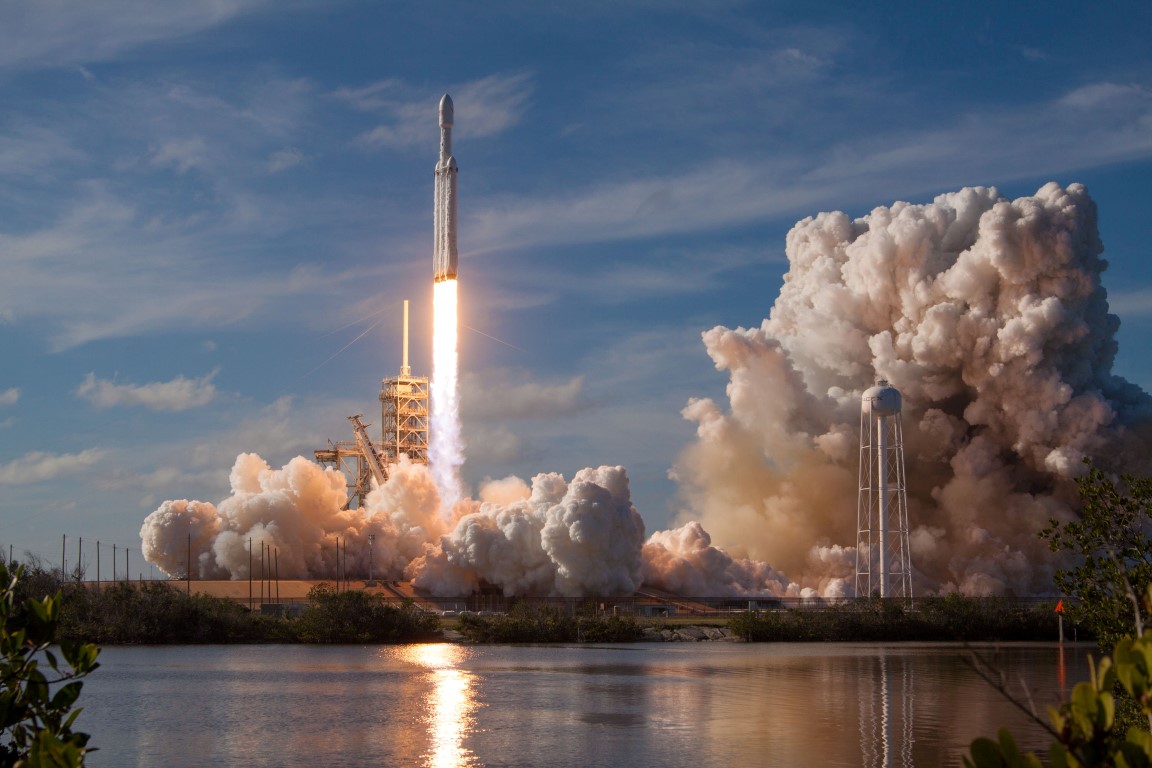 The SpaceX Falcon Heavy rocket lifts off from launch pad 39-A at the Kennedy Space Center in Cape...