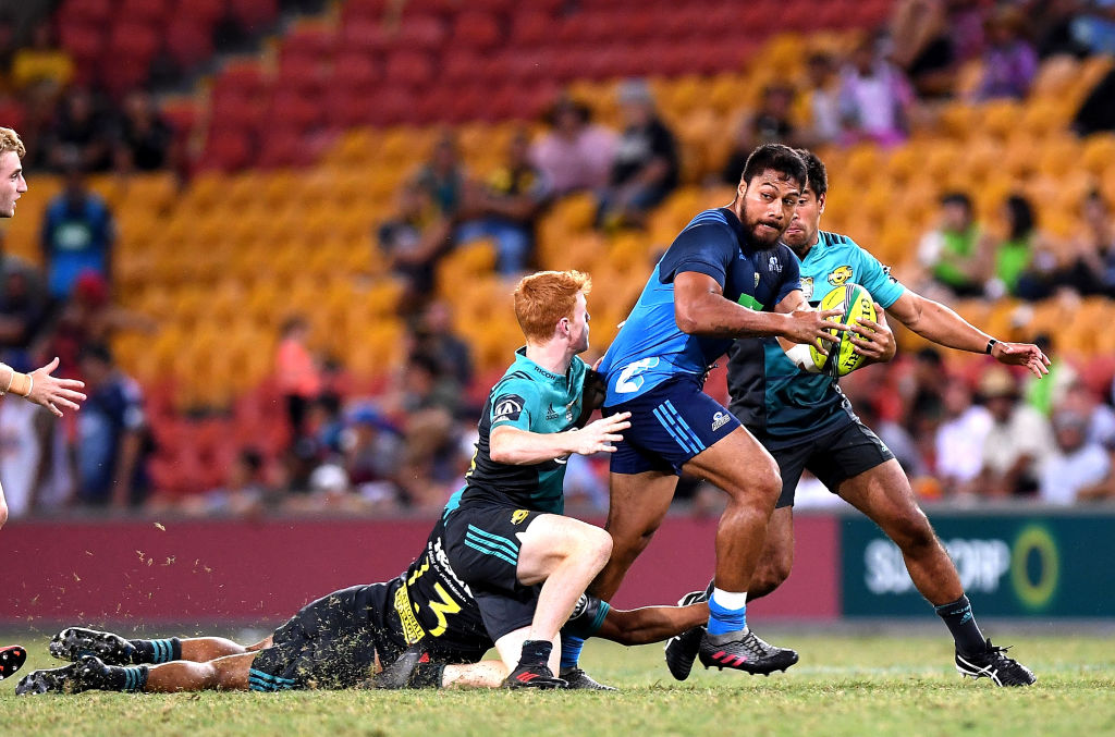 The Blues' George Moala tries to bust through the Hurricanes defence. Photo: Getty