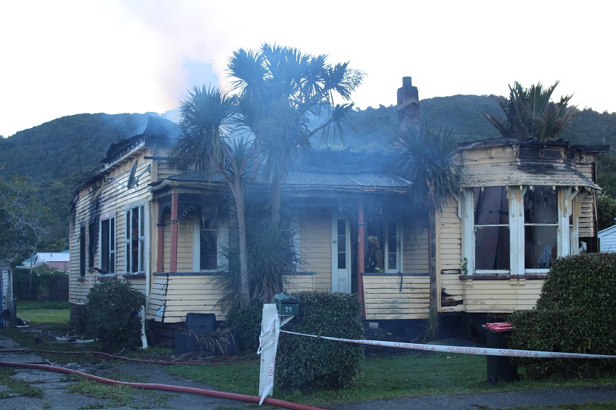 The remains were still smouldering this morning after a flare-up about 8am. Photos: Greymouth Star