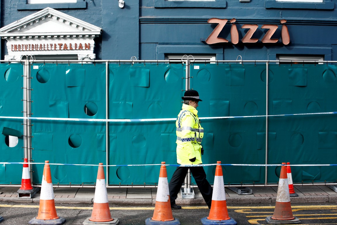 A police officer stands on duty outside a restaurant in Salisbury which has been secured as part...