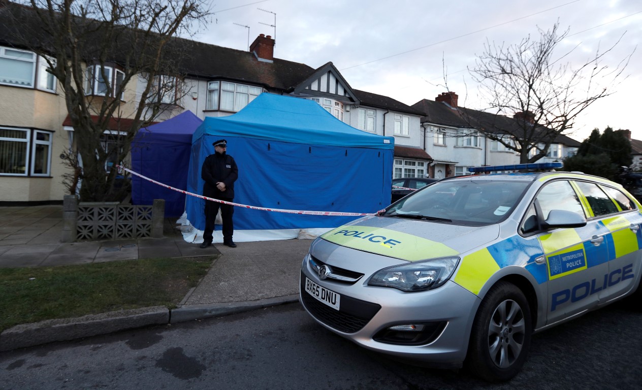 A police officer stands guard outside the home of Nikolai Glushkov in London. Photo: Reuters