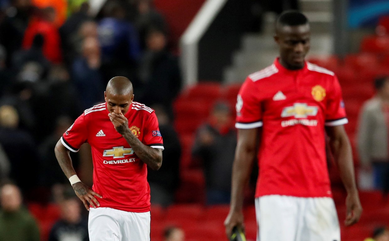 Dejected Manchester United players Ashley Young (L) and Eric Bailly after the match Photo: Reuters